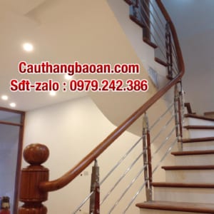 Cầu thang inox tay vịn gỗ , lan can inox tay vịn gỗ