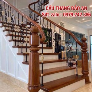 Cầu thang sắt nghệ thuật . Cầu thang lan can sắt tay vịn gỗ đẹp tại Hà Nội