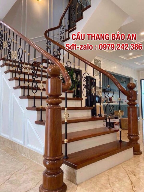 Cầu thang sắt nghệ thuật . Cầu thang lan can sắt tay vịn gỗ đẹp tại Hà Nội